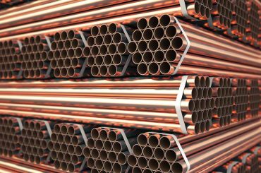 Copper or bronze metal pipes in warehouse. Heavy non-ferrous metallurgical industry. 3d illustration